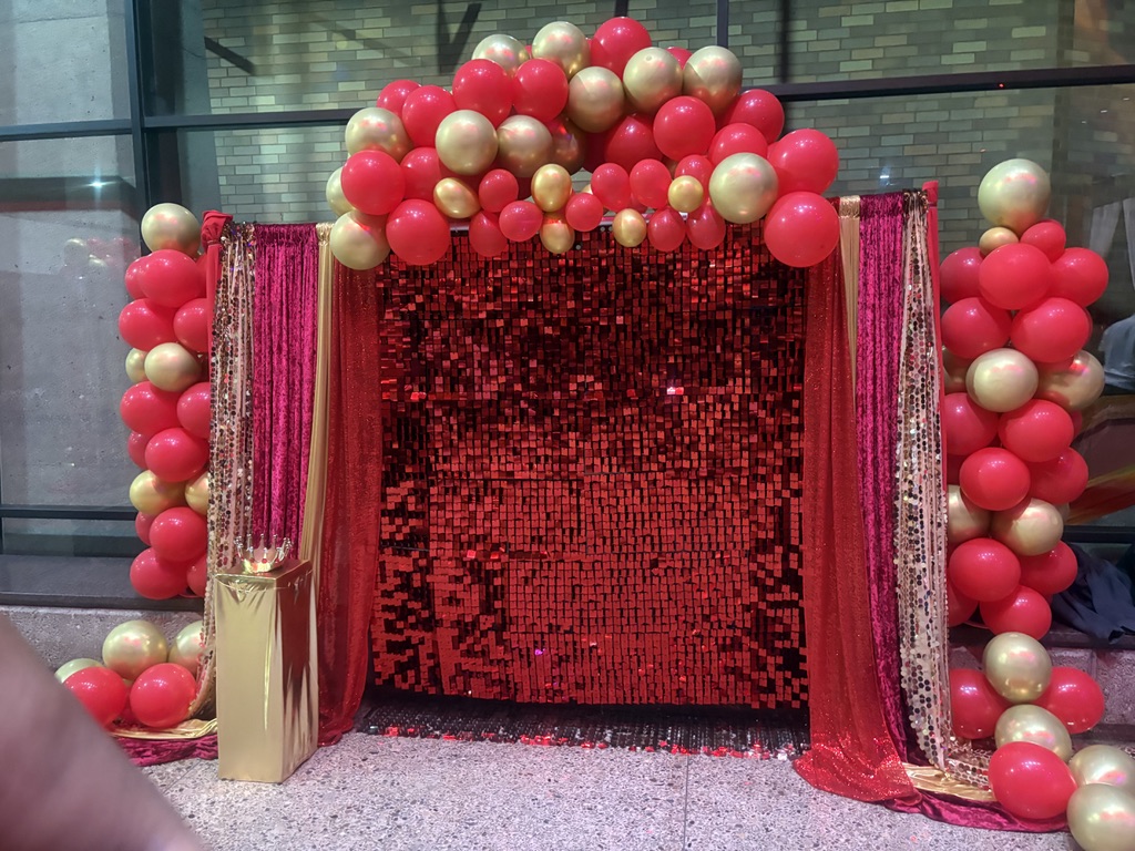 Red and Gold Shimmer Wall Backdrop with Balloon Arch